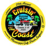 Classic cars lined up along the Gulf Coast highway, polished and ready for Cruisin’ The Coast under blue skies.